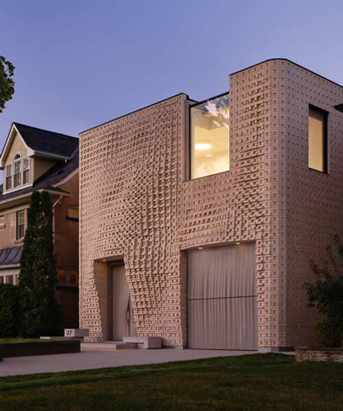 dramatic brick undulations flow across partisans' canvas house in toronto, canada